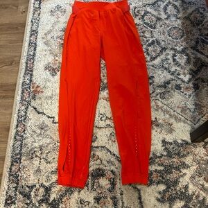 Orange lululemon joggers size 0. Brand new. Wore once!